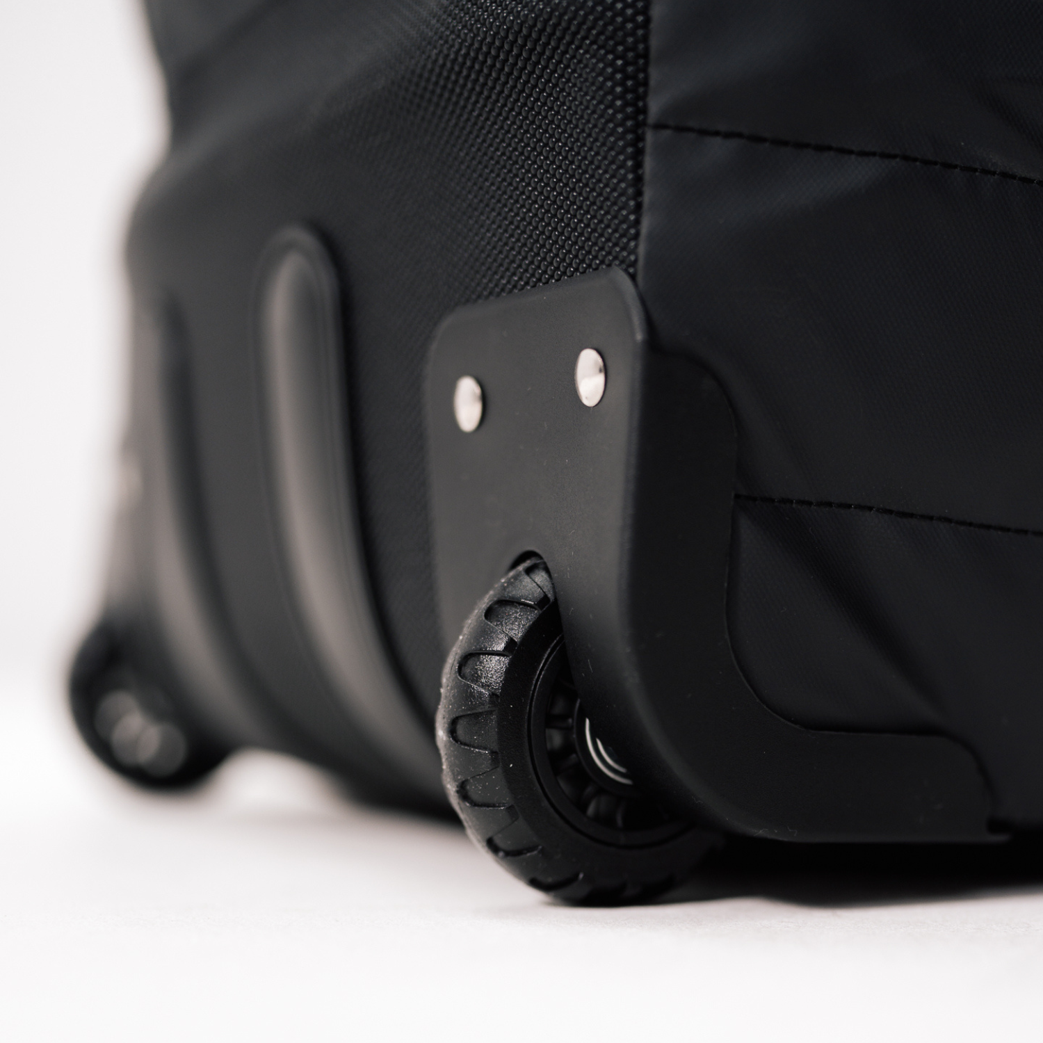 Close-up of Sportr Golf Travel Bag wheels on a white background