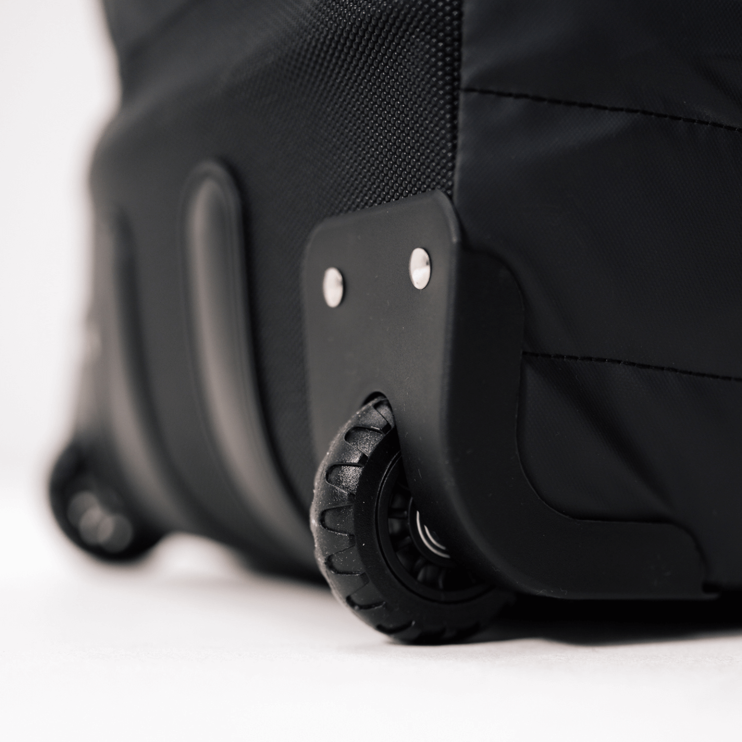 Close-up of Sportr Golf Travel Bag wheels on a white background