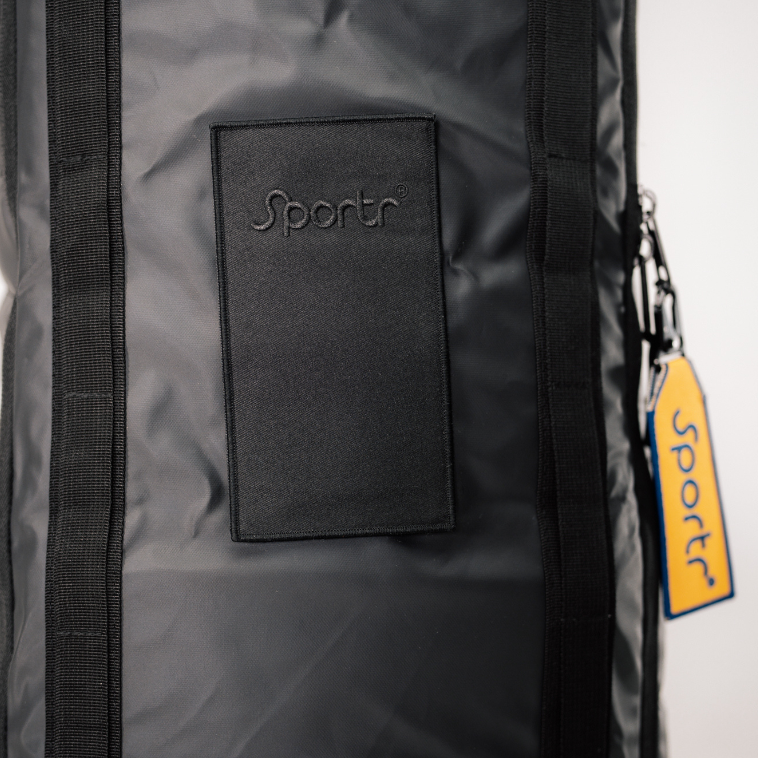 Black Golf Travel Bag with 'Sportr' branding on a white background